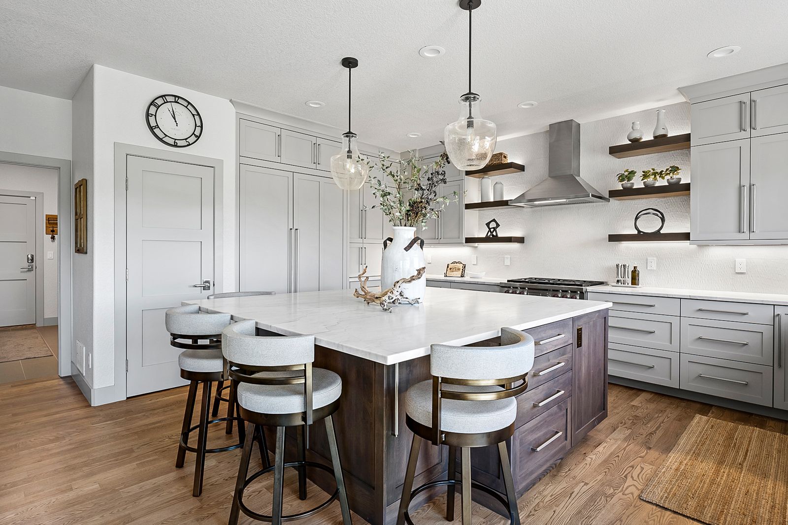 Evoke framed kitchen with a white perimeter and a dark wood island